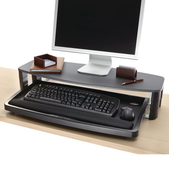 keyboard tray on top of desk